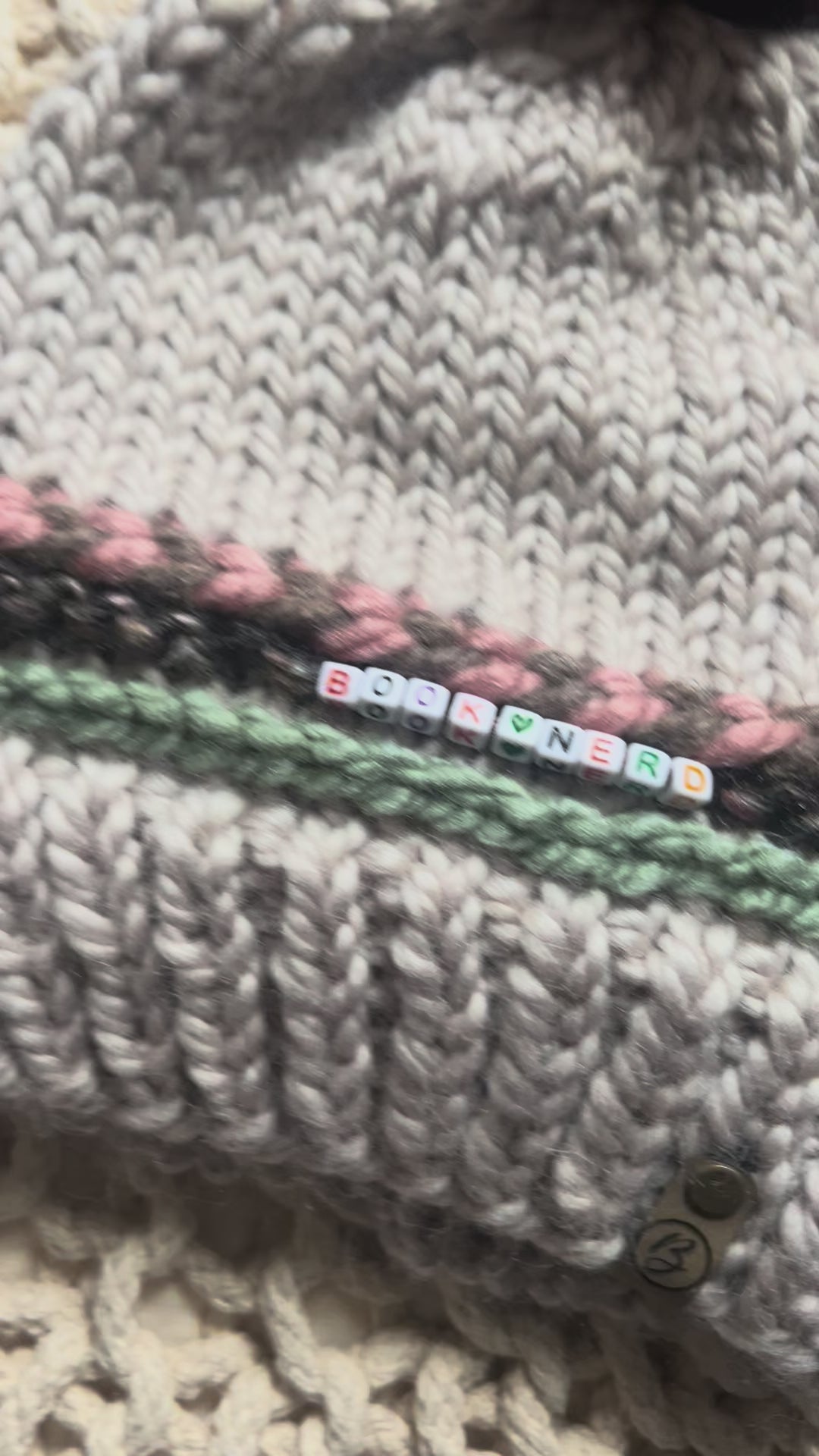 Load video: Friendship Bracelet Knitted Beanie - Book Nerd